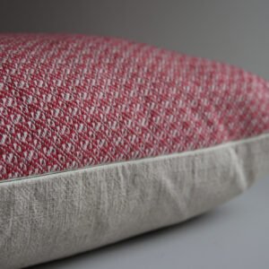 wool and cotton cushion in rose pink close up of YKK zip and hand woven design.