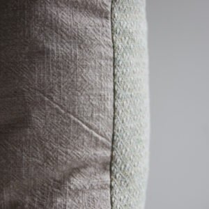 wool and cotton cushion in sage green with stonewashed linen back, soft home decor cushion
