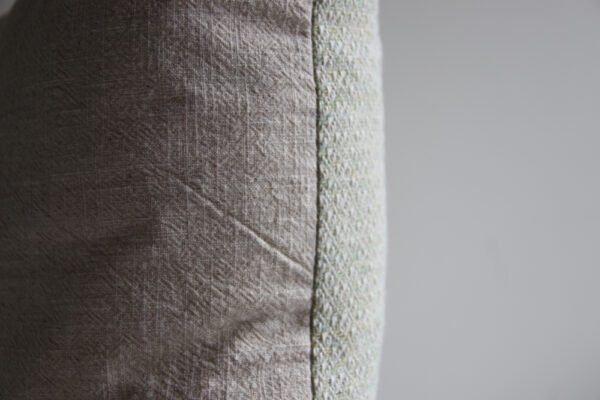 wool and cotton cushion in sage green with stonewashed linen back, soft home decor cushion