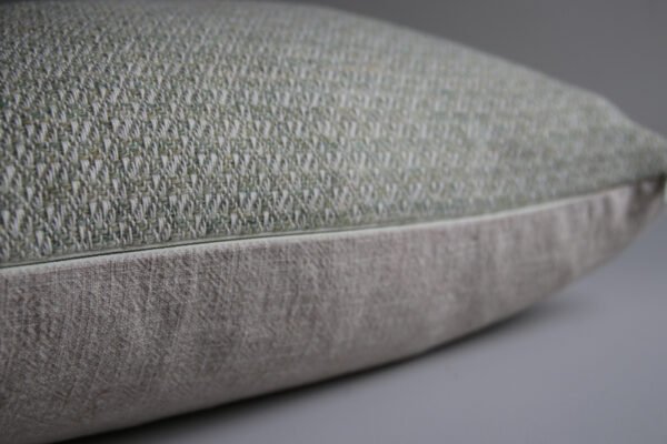 wool and cotton cushion in sage green closeup of YKK zip details in cosy cushion