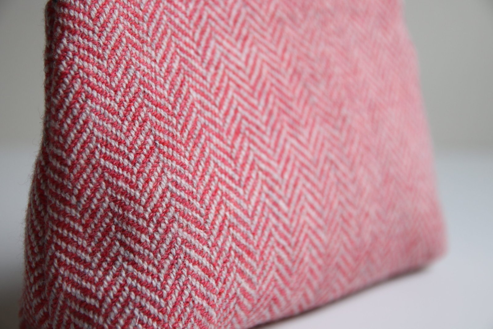 magnified detail of the handwoven cloth of a pouch